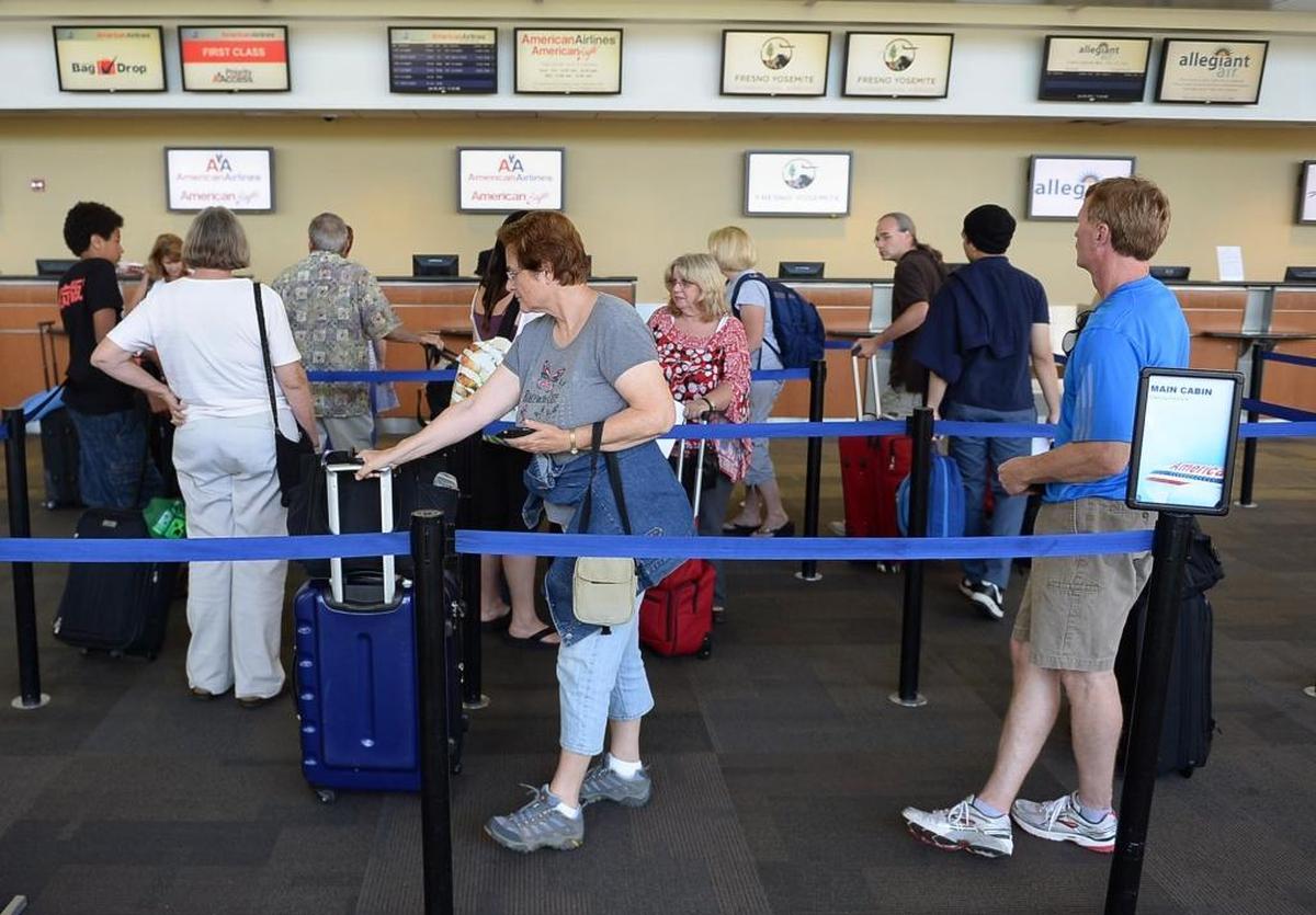 Passengers weave their way to the check-in counter at Fresno Yosemite International Airport on June 28, 2013.