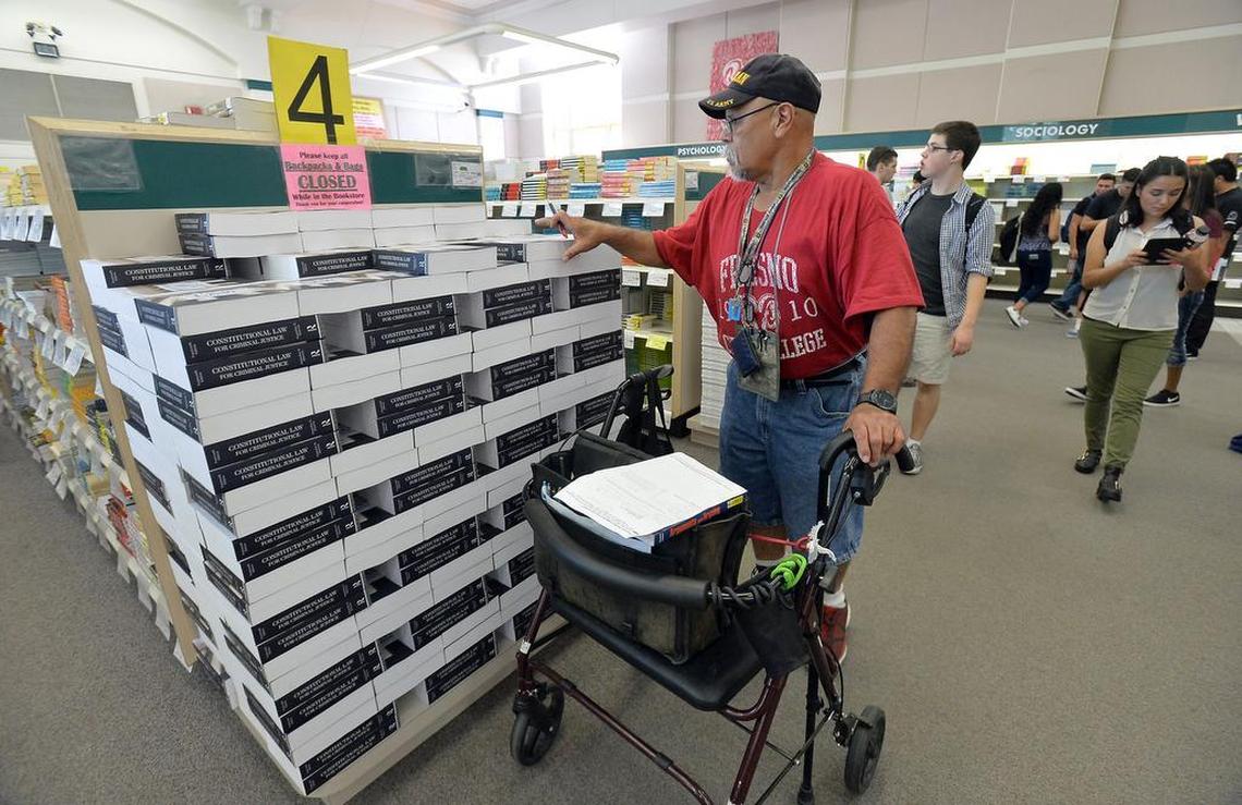 Edward Canel, 64, of Fresno, picks up textbooks at the bookstore on the first day of the fall semester at Fresno City College in Fresno, California on August 17, 2015. Canel was returning to school after 22 years.