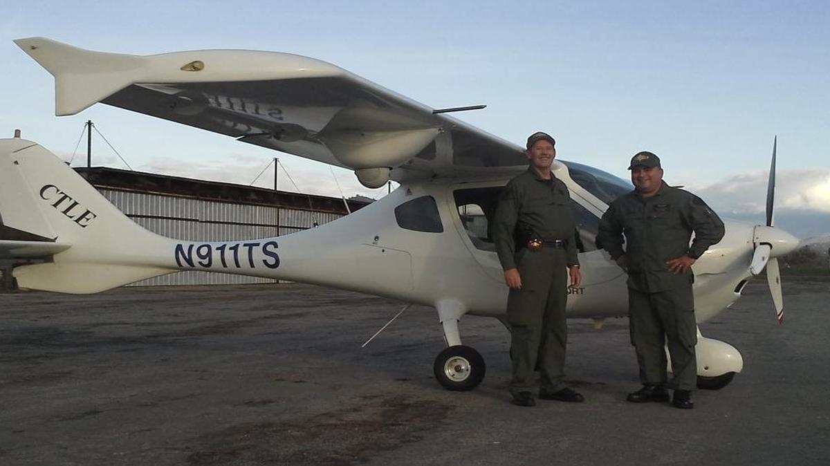 Tulare County Sheriff’s Deputy Scott Ballantyne and pilot James Chavez pose for a photo with Sheriff One. The two men were killed Feb. 10, 2016 when this light sport aircraft crashed into the side of a mountain along Highway 190 near Lake Success.