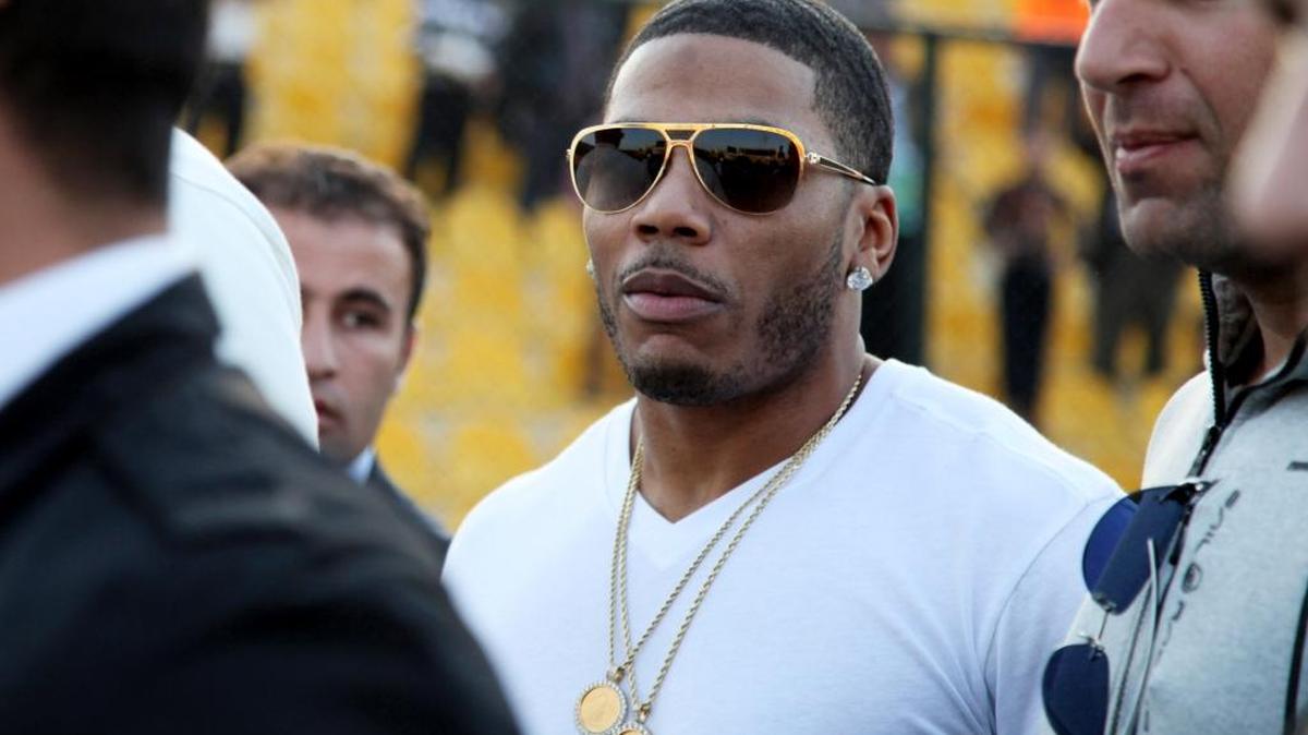 
Nelly approaches the stage for a March concert .
