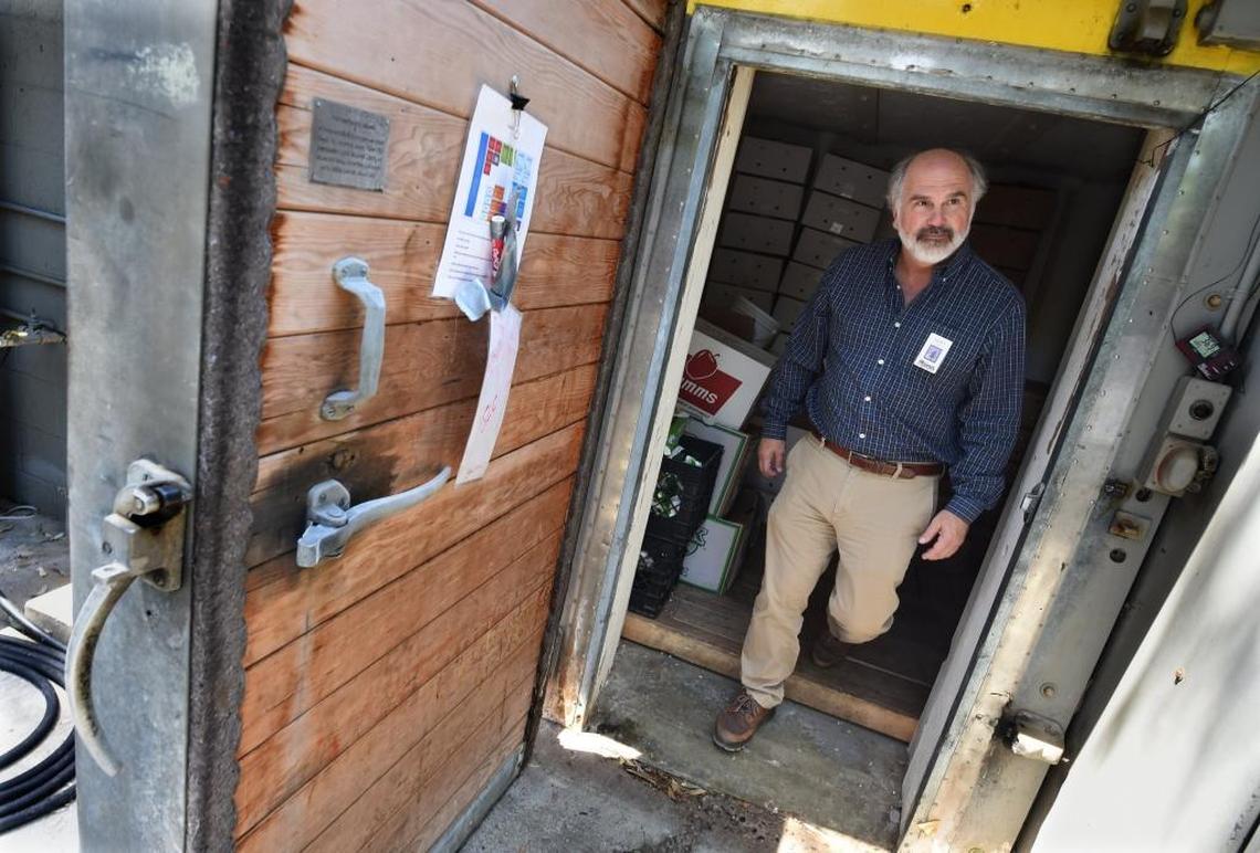 Fresno Chaffee Zoo director Scott Barton shows the antiquated refrigeration unit at the commissary where meals are prepared for animals. It will be replaced in the next round of Measure Z construction projects.