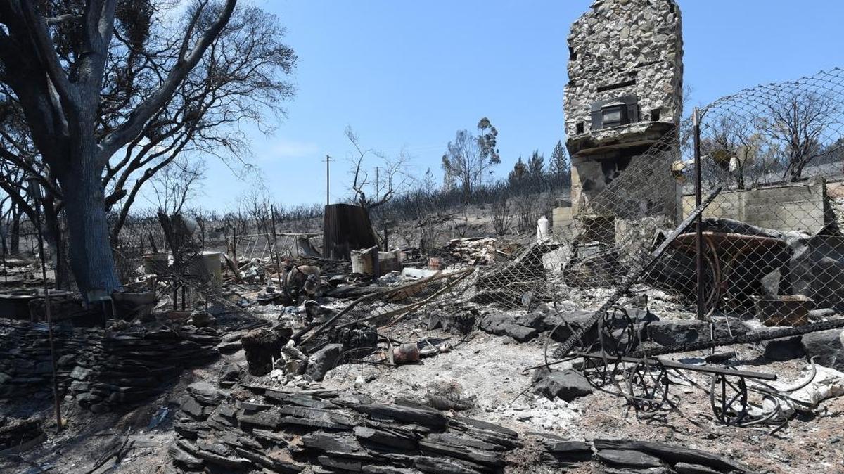 A two-story fireplace stands in the ruins of a Mt. Bullion home that was burned down in the Detwiler Fire as seen Aug. 2, 2017.