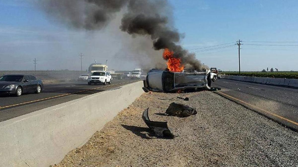 
Cadee Cardoza’s SUV on Highway 99 near Madera seconds after she was pulled to safety by Kirk Cardoso.
