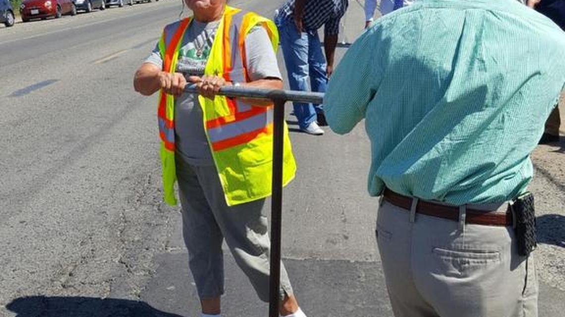 Matheny Tract Committee members Reinelda Palma and Tim Denney turn the valve Tuesdayto let clean drinking water flow to their community.
