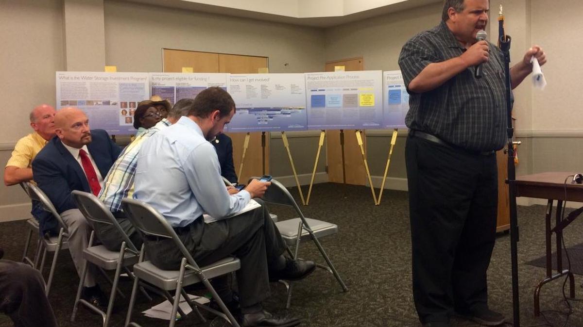 
Greg Musson, president of Gar Tootelian in Reedley who is running the #moreDamstorage campaign,  criticizes the Water Storage Investment Program timeline during a California Water Commission meeting Wednesday night in Clovis.
