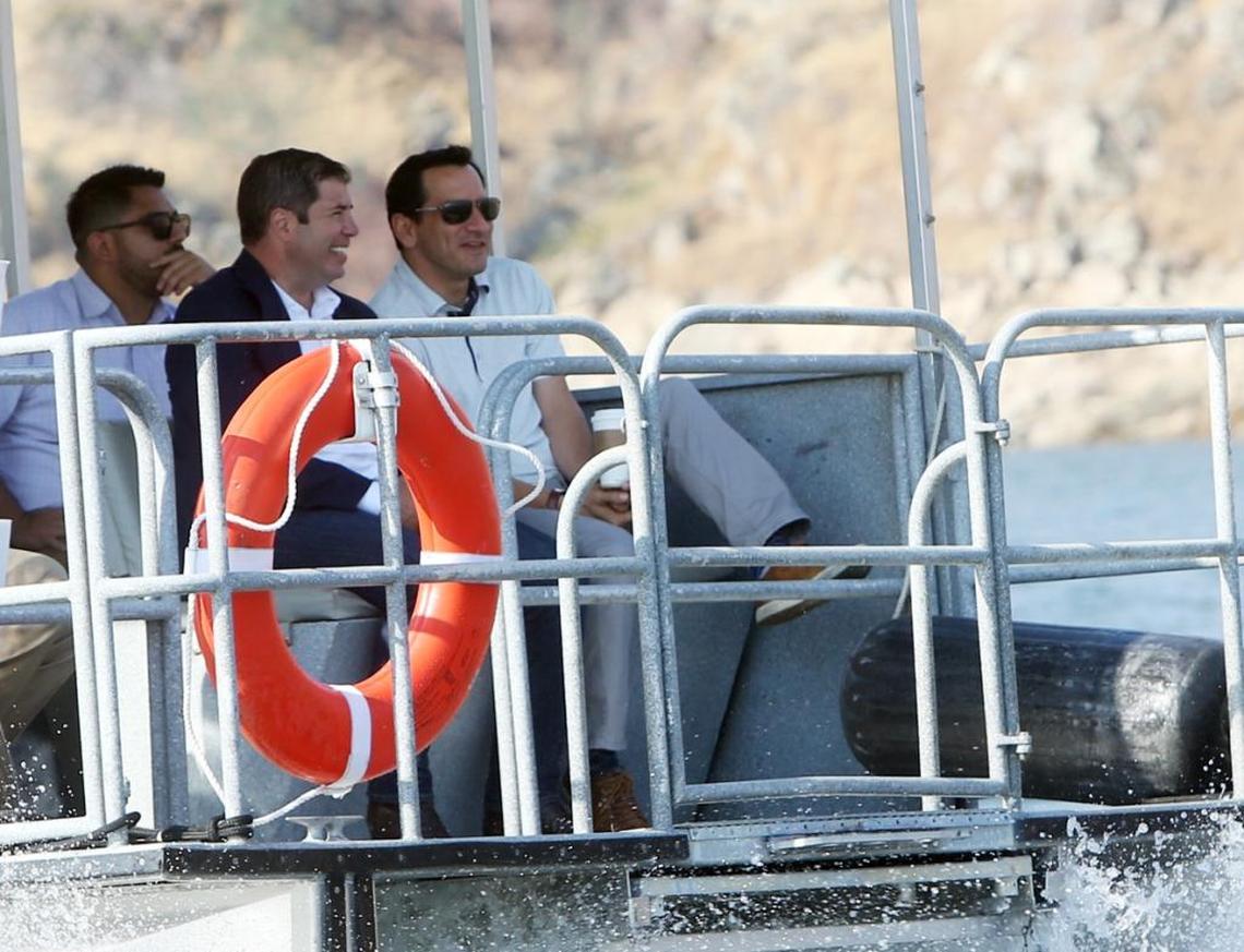 California Assembly Members Juan Arambula, D-Fresno, center and Assembly Speaker Anthony Rendon, D-Lakewood, right, ride across Millerton Lake to the proposed site of the Temperance Flat dam on Tuesday.