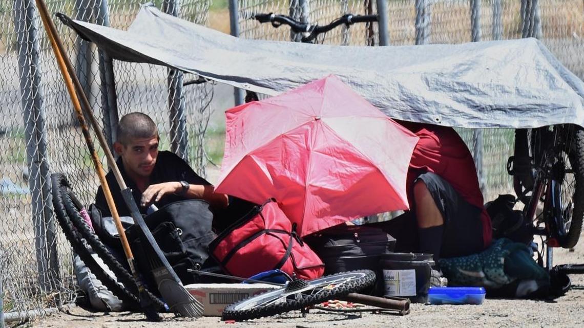 Homeless people camp on Mono Street at Fresno’s Chinatown.