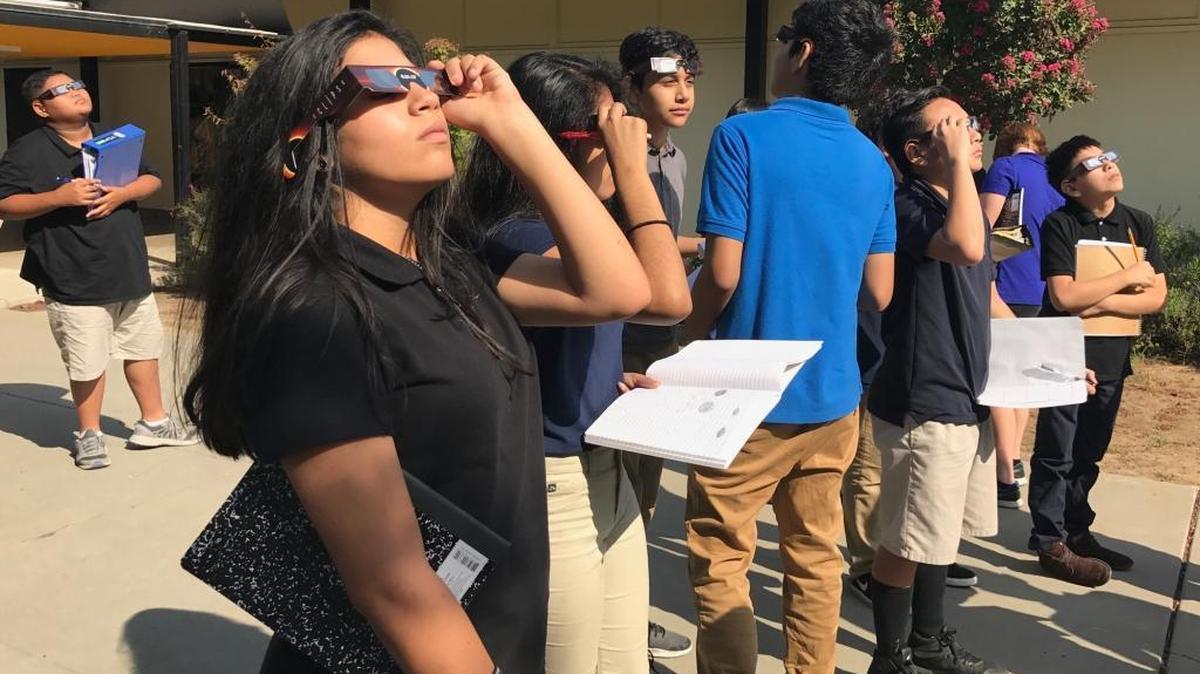 Students at Edison Computech middle school in Fresno make their early observations of the solar eclipse Monday, Aug. 21, 2017.
