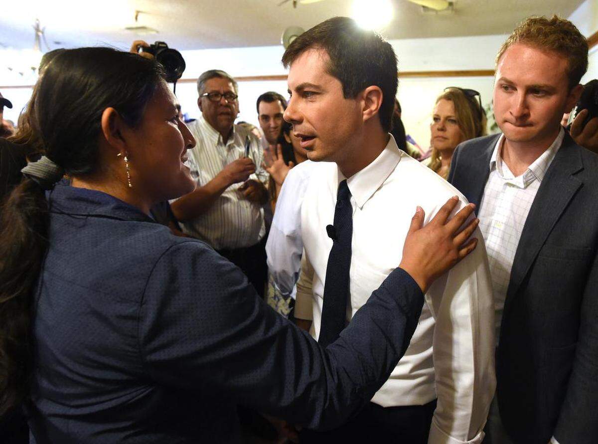 Magdelena Gomez, a Trustee for the State Center Community College District, talks with Democratic presidential candidate Pete Buttigieg after he spoke to a packed crowd at Tuolumne Hall in downtown Fresno on Monday morning, June 3, 2019.