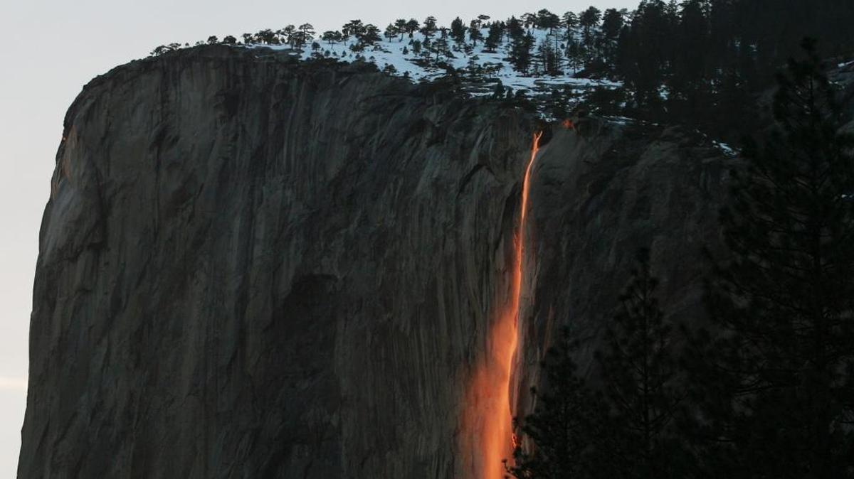 The annual Firefall from Horsetail Fall in Yosemite Valley glows after the sun has disappeared below the horizon. Conditions need to be just right for the glow: Skies must be clear just as the sun sets, mid-February allows the correct positioning of the sunset, and water needs to be flowing from the fall.