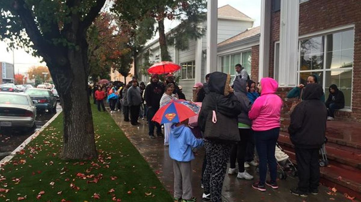 Fresno families started lining up at 2 a.m. in the rain for a turkey and food distribution at Catholic Charities, near downtown Fresno.