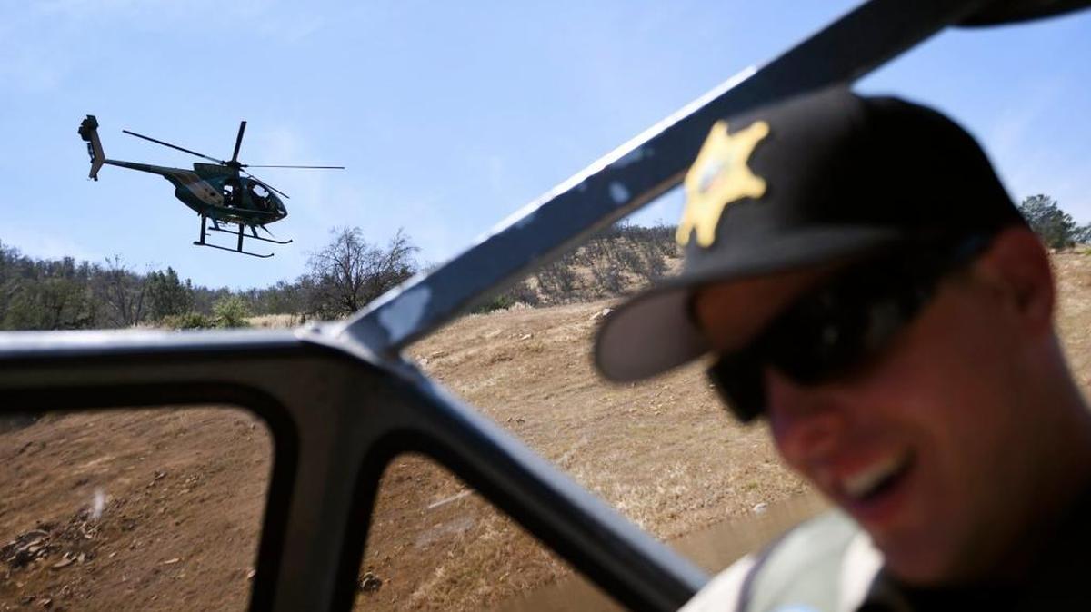 A Fresno County Sheriff’s Office Air Support helicopter flies low as the office’s Boating Safety Unit trains reserve deputies on water rescues Friday, May 13, 2016 at Pine Flat Lake.
