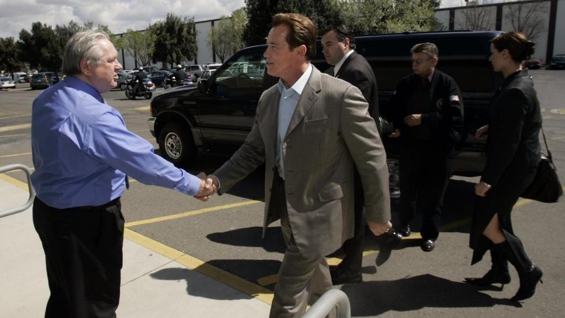 Jim Boren greets then-California Gov. Arnold Schwarzenegger at The Bee in 2006. Boren, whose entire 48-year journalism career has been at The Fresno Bee including the last five as executive editor and senior vice president, is retiring in January 2018.