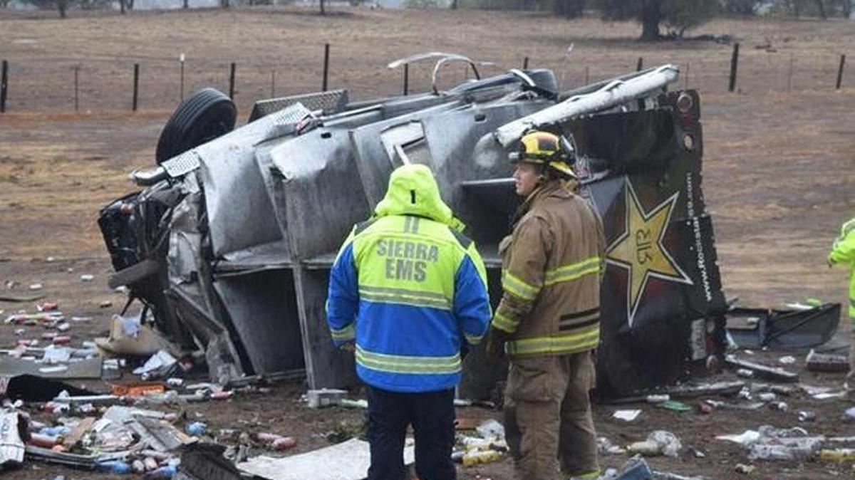 Emergency workers survey the scene after this delivery truck crashed off Highway 41 and down an embankment near Chukchansi casino Monday afternoon.