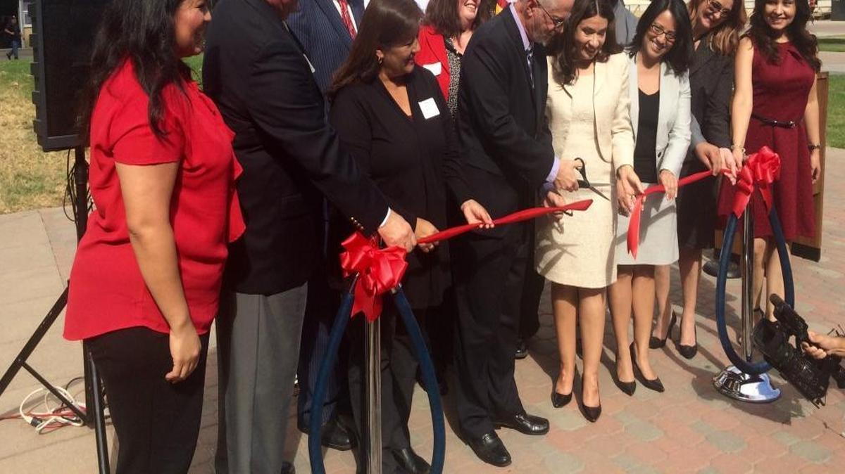
Richard Newton, of the U.S. Department of Labor, cuts the ceremonial ribbon during the launch of EMPLEO in Fresno. EMPLEO is a program that connects Spanish-speaking workers to employment resources. 
