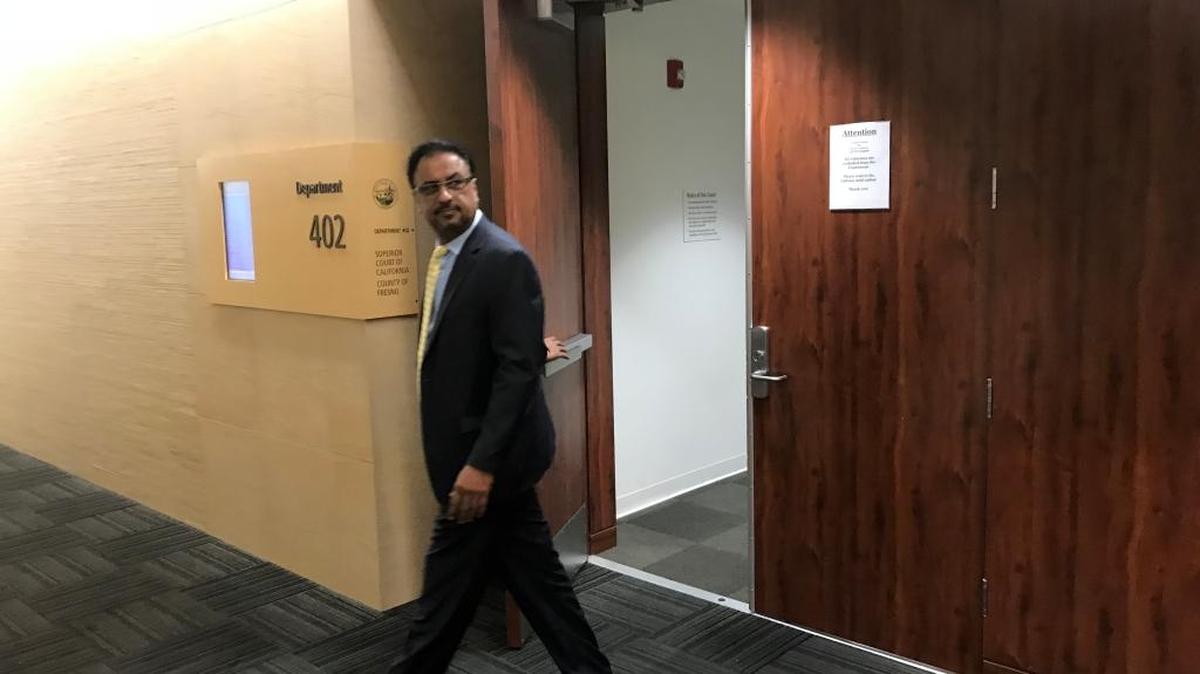 Fresno heart surgeon Pervaiz Chaudry leaves the courtroom during a break in medical malpractice civil trial in Fresno County Superior Court. Chaudhry is accused of negligence for leaving the operating room during open-heart surgery in April 2012 and ordering his physician assistant to close up a patient’s chest. While Chaudhry was gone, the patient’s heart stop and today remains in a coma, testimony has revealed.