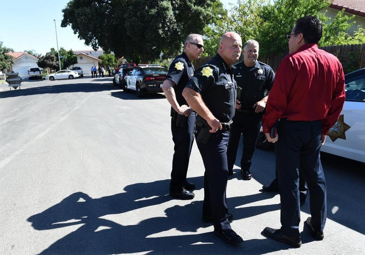 Fresno police Chief Jerry Dyer is briefed near the scene of the shooting at 5267 E. Hammond Ave. in east-central Fresno on Tuesday morning, June 6, 2017. Police said four people were shot; three are dead.