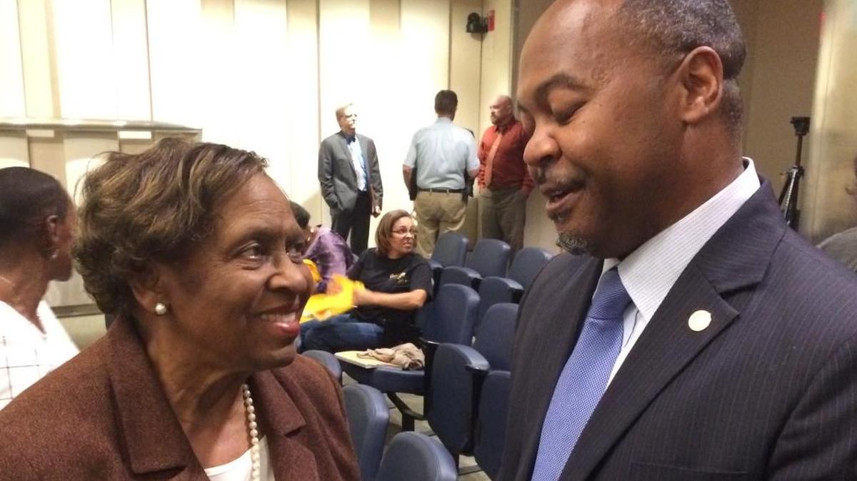 Longtime southwest Fresno resident Mary Curry and Fresno City Councilmember Oliver Baines celebrate after the council in October 2017 approved an agreement with Darling International for the company to move its meat-rendering plant out of a southwest neighborhood.