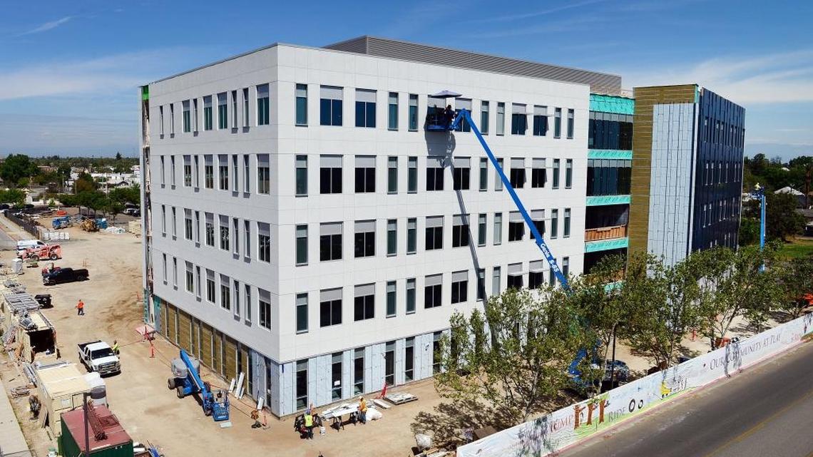 Crews work on a new medical office building taking shape on the Community Regional Medical Center campus in downtown Fresno on Tuesday, April 4, 2017.