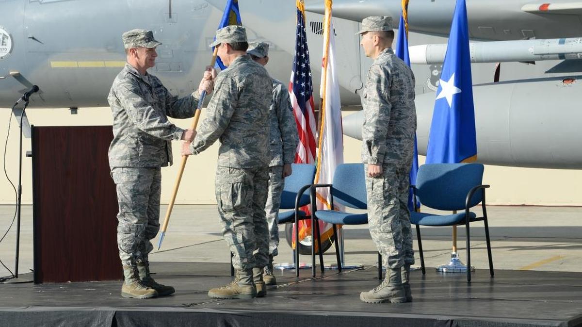 Air Force Col. Daniel Kelly assumes command of the 144th Maintenance Group from Col. Mark Favetti during a change of command ceremony on Sunday in Fresno.
