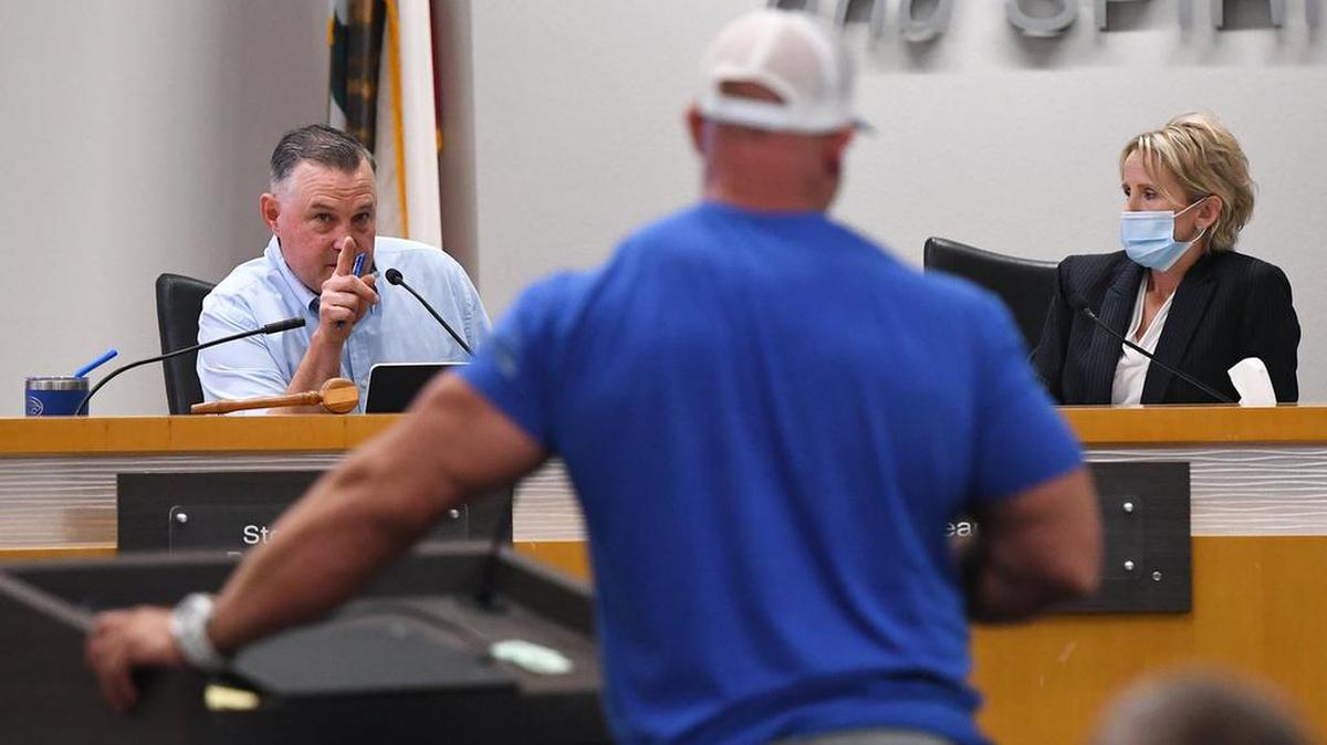 Clovis Unified School District board member Steven Fogg (left) addresses a parent’s questions (center) with then Superintendent Eimear O’Farrell (right) on Wednesday night, Aug. 11, 2021 in Clovis.