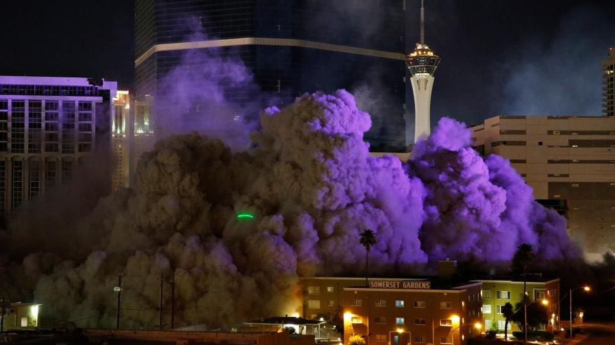 The Monaco Tower at the Riviera Hotel and Casino crumbles to the ground during a controlled demolition, Tuesday, June 14, 2016, in Las Vegas. The casino opened in 1955 and was closed last year to make room to expand the Las Vegas Convention Center.