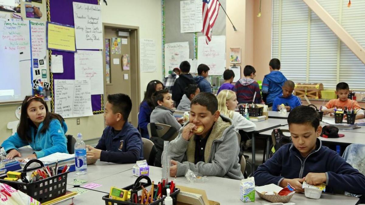 In this 2015 photo, poor students are served breakfast at the Stanley Mosk Elementary School in Los Angeles. About 80 percent of Los Angeles Unified School District are considered to be poor or English-learners, qualifying the district for extra state funds to raise their academic achievement. Statewide, about 60 percent of students are considered “at-risk” for poverty or lack of English skills.