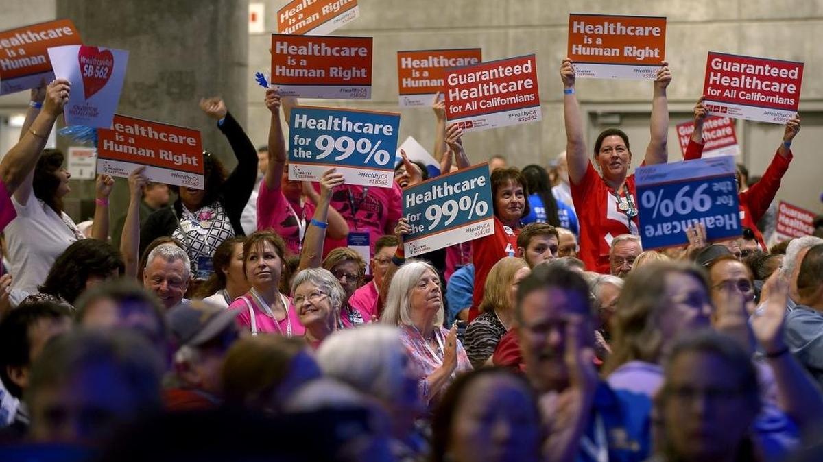 Demonstrators demand passage of Senate Bill 562, which would create state-managed single-payer health care coverage for Californians, at May’s state Democratic convention in Sacramento. The measure has become one of the most controversial items on this year’s legislative agenda.