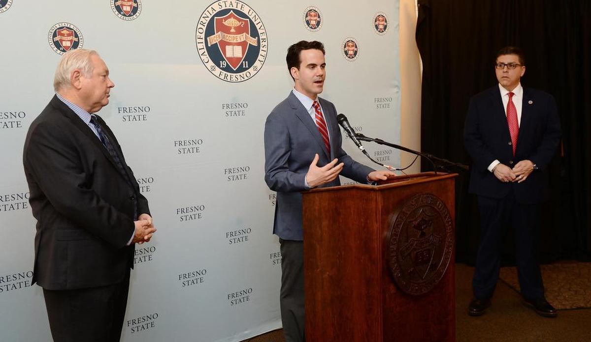 Robert Costa, center, Washington Post political reporter and moderator of PBS’s “Washington Week,” speaks to the media prior to his Fresno State lecture “An In-Depth Conversation with Robert Costa: Inside the Trump White House, Congress and the Future for Both Parties” while Fresno State President Joseph Castro, right, and Jim Boren, director of the University’s Institute for Media and Public Trust, stand nearby at the Save Mart Center on Tuesday, Nov. 27, 2108.