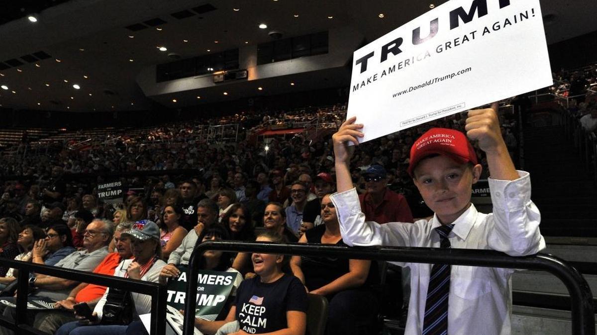 A young supporter holds his sign proudly during Donald Trump’s rally Friday morning, May 27, 2016, at Selland Arena.