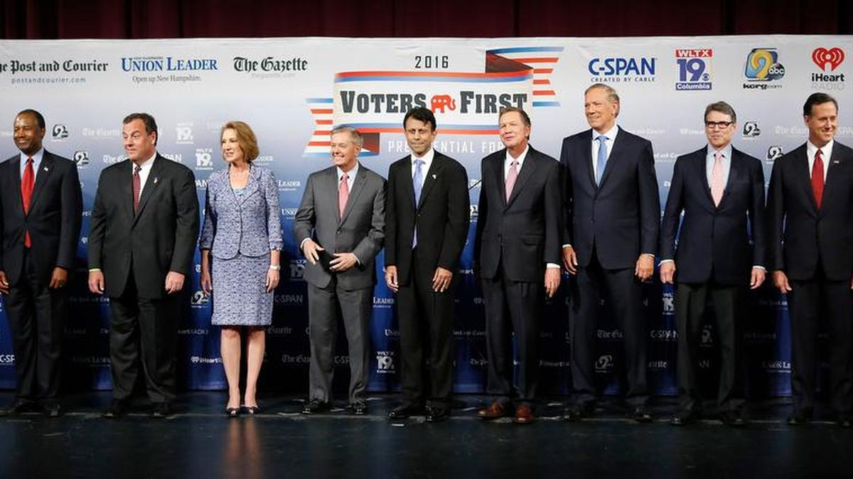 Republican presidential candidates gather on stage before a forum Monday in Manchester, N.H. From left: Jeb Bush, Ben Carson, Chris Christie, Carly Fiorina, Lindsey Graham, Bobby Jindal, John Kasich, George Pataki, Rick Perry, Rick Santorum, and Scott Walker.