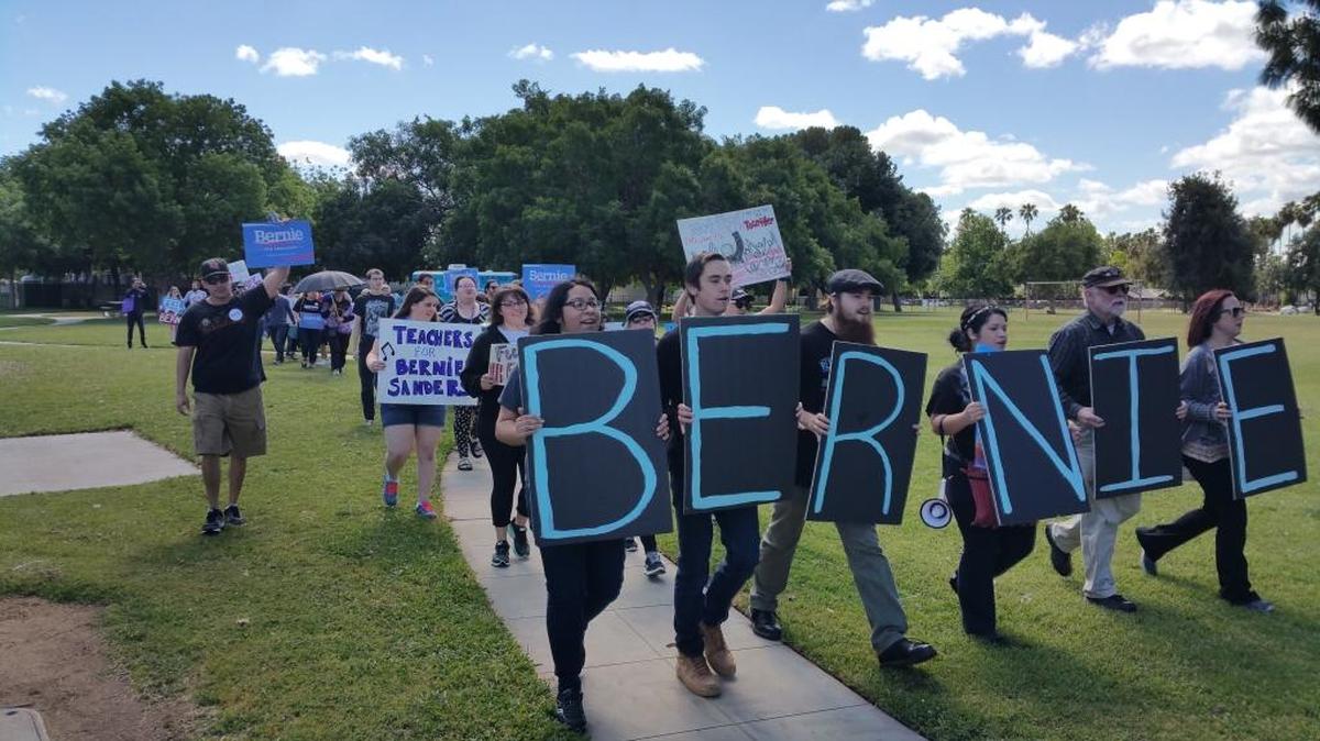 Bernie Sanders supporters leave Robinson Park as they begin their march toward Blackstone Avenue on Saturday, April 23, 2016. About 75 people were in the march, which went from Bullard Avenue up to Herndon Avenue.