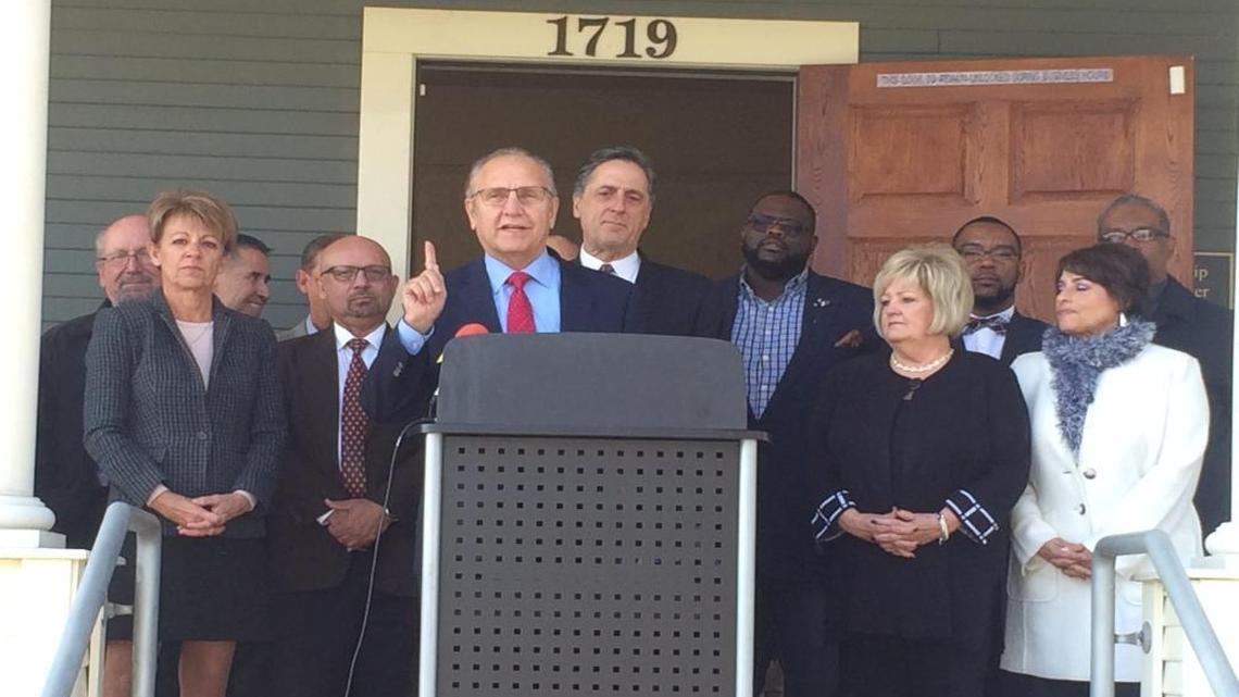 Fresno Mayor-elect Lee Brand, with community leader H. Spees to his immediate left and members of his transition team also present, speaks Wednesday in front of the Leadership Training Institute in downtown Fresno. Spees will be Brand’s director of strategic initiatives.