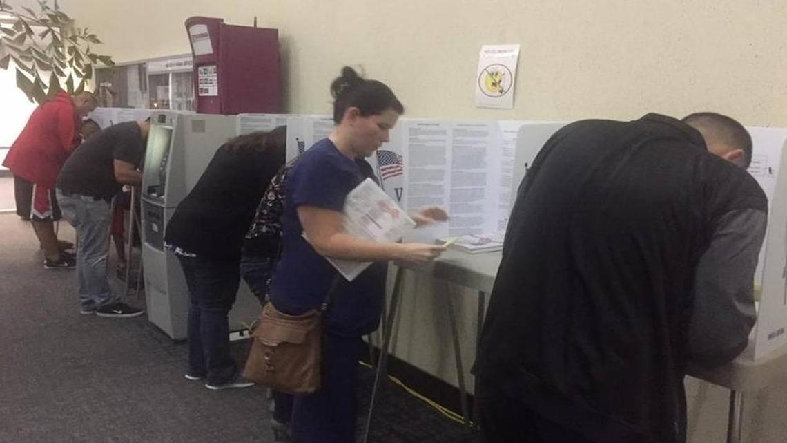 Voters cast their votes after waiting in line past 8 p.m. on Election Night 2016 at the Tulare County elections office in Visalia.