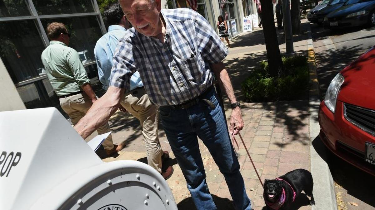 John Hix, 83, of Easton, drops off his ballot at the Fresno County Clerk’s office Monday afternoon.