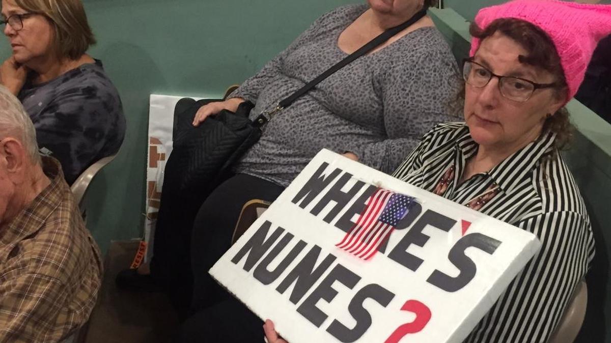 Cathy Brass of Fresno holds a homemade “Where’s Nunes?” sign at a town hall-style meeting Wednesday in Visalia.