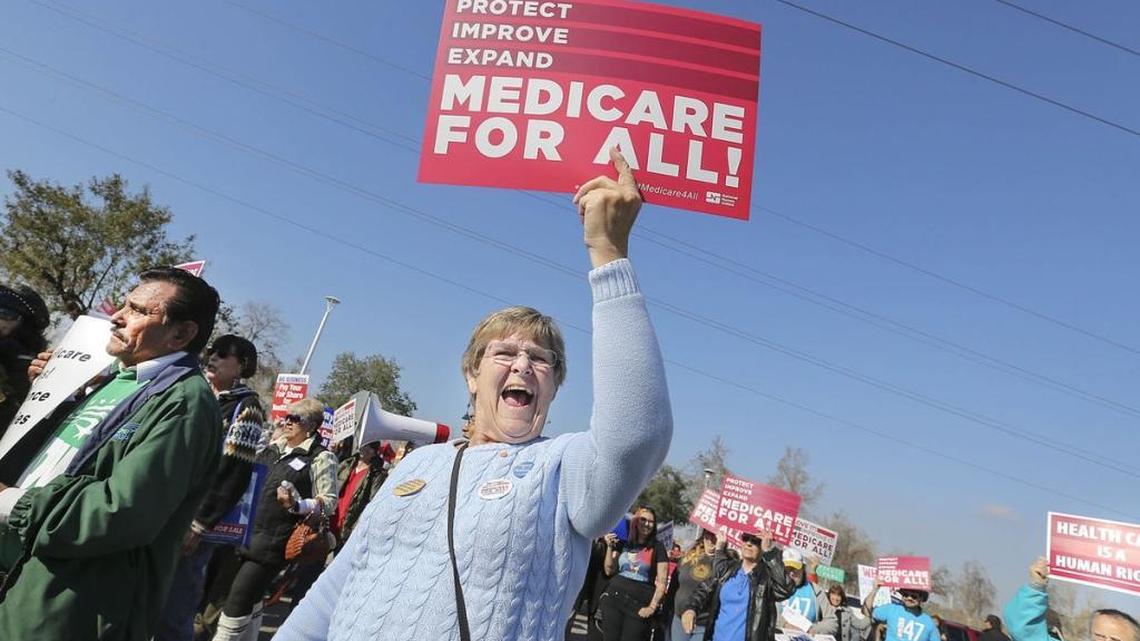 Ginny Schwingel from Santa Cruz is one of hundreds of people marching from Yokuts Park in Bakersfield to Congressman Kevin McCarthy’s office to protest the congressman’s views on access to healthcare.