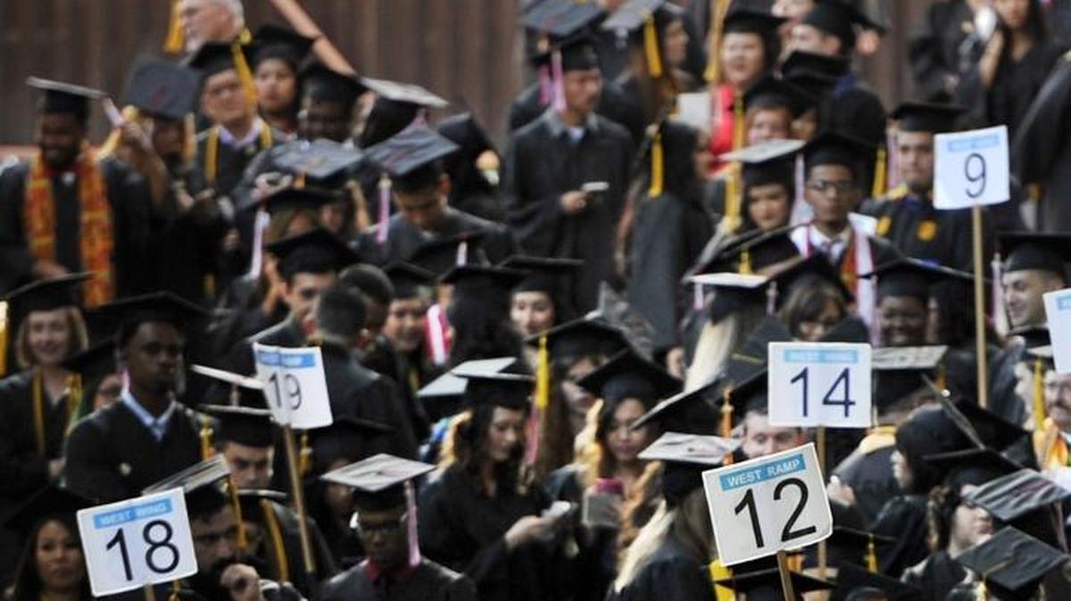 Graduates line up before Fresno City College observes its 2016 commencement at Selland Arena.
