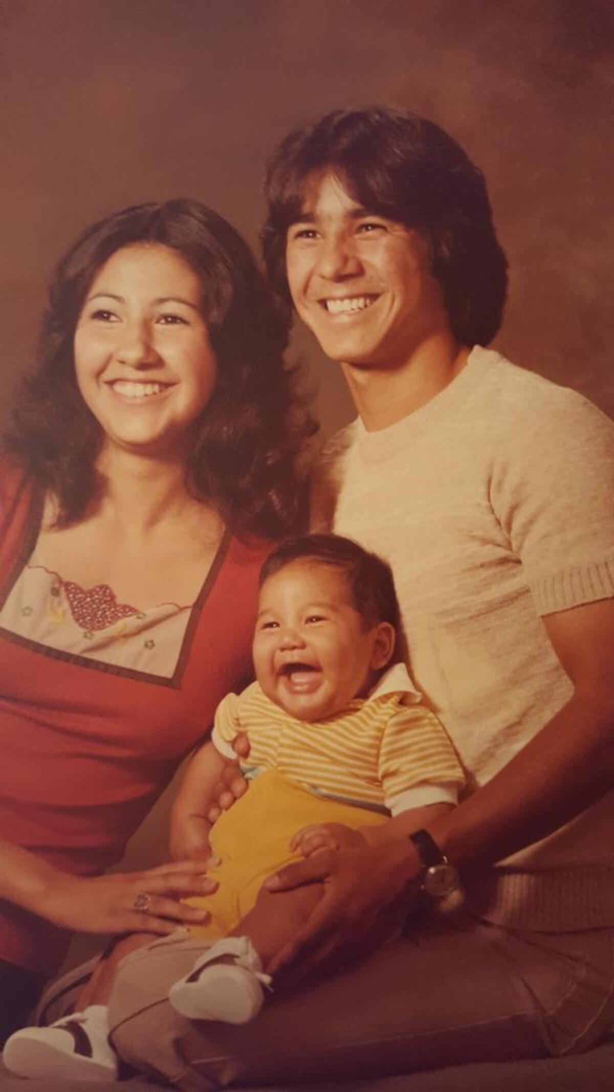 Johnny Baltierra, seen here as a Fresno High student, poses with his wife, Susan, and their 1-year-old son, Michael, in 1977.
