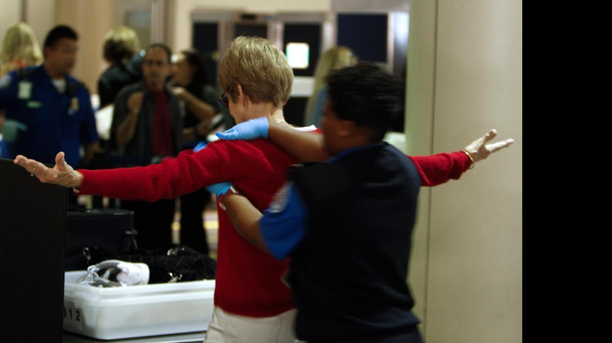 
A TSA agent pats down a traveler at Los Angeles International Airport in 2011. Soon after a Homeland Security Inspector General’s report that cited a 5% success rate in security tests was leaked to ABC, the acting TSA administrator, Melvin Carraway, was forced out and a U.S. Senate committee moved to confirm his successor, U.S. Coast Guard Vice Adm. Peter Neffenger.
