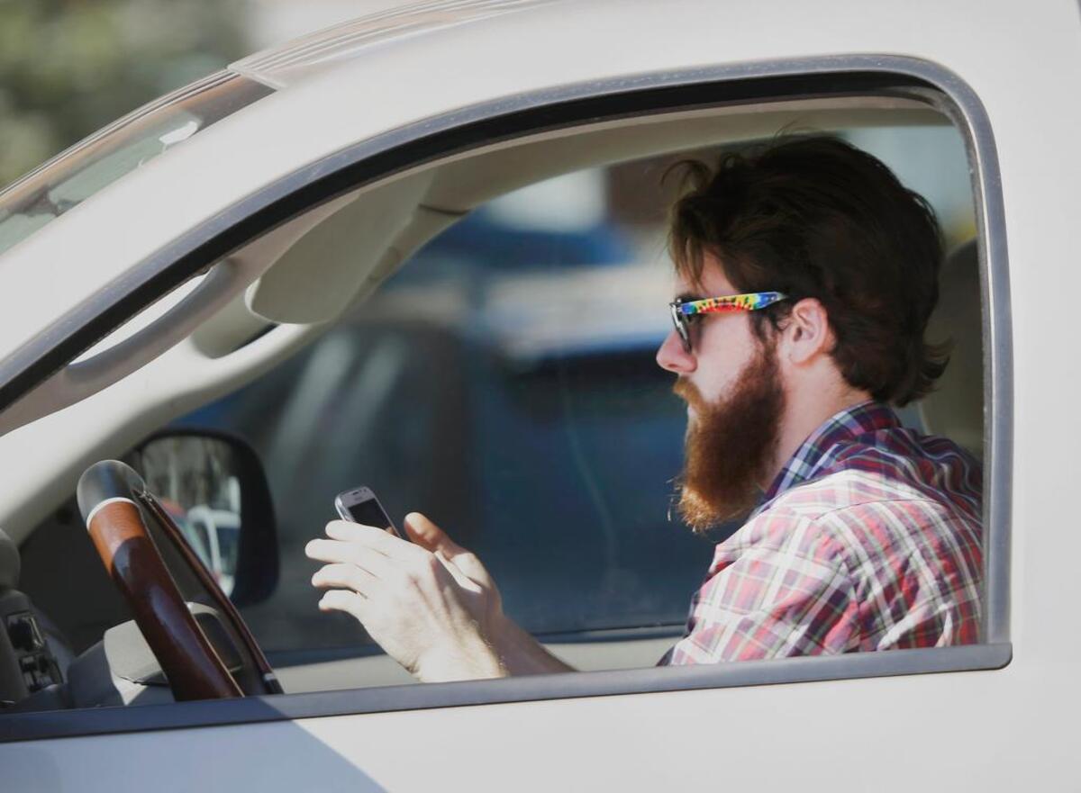 In California, it’s illegal to drive a car while holding a phone to text or call.