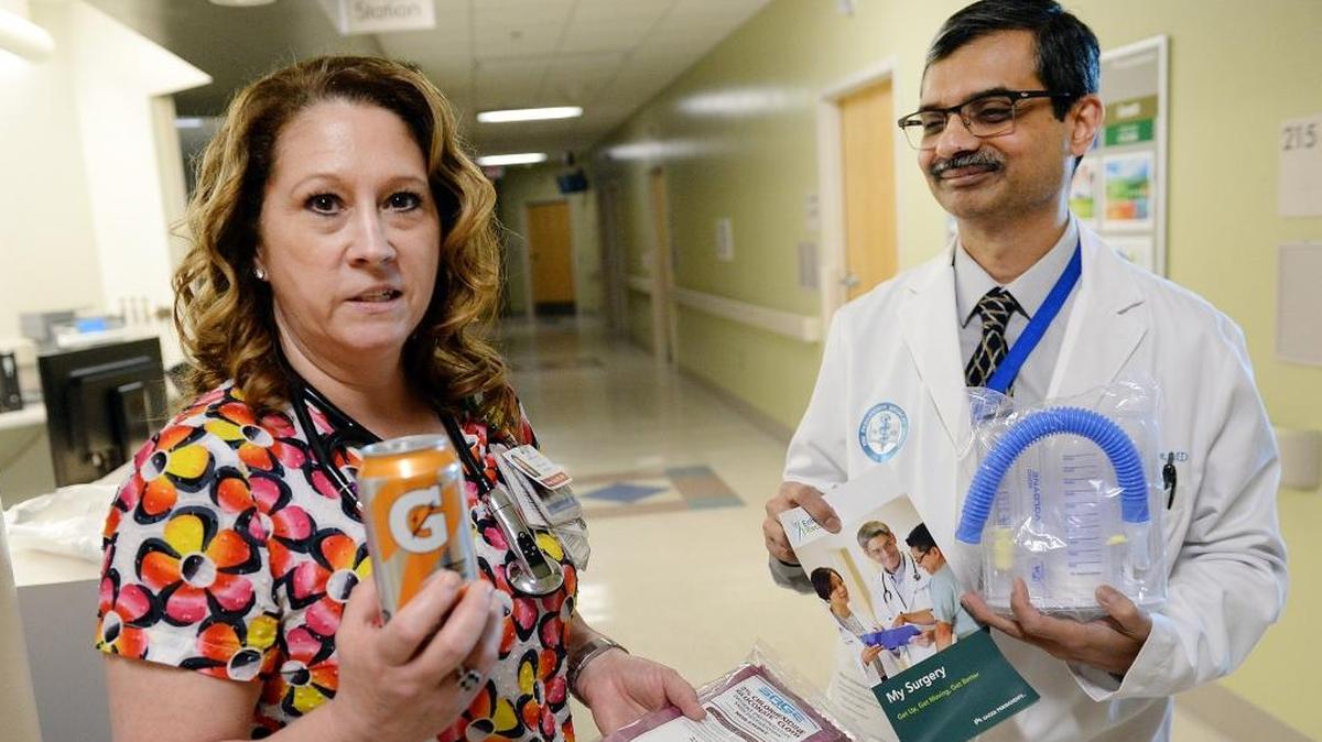Registered nurse Shirlene Daw holds up a can of Gatorade while showing a pre-surgery package with Dr. Subhendra Banerjee at Kaiser Permanente Hospital in Fresno on Wednesday, April 25, 2018. The Gatorade helps patients with nausea after surgery, they said. Dr. Banerjee oversees the Enhanced Recovery After Surgery program, which helps patients recover from surgery more quickly and without opioids being prescribed for pain management. Such a program is also being used at Community Medical Centers in Fresno and Clovis.