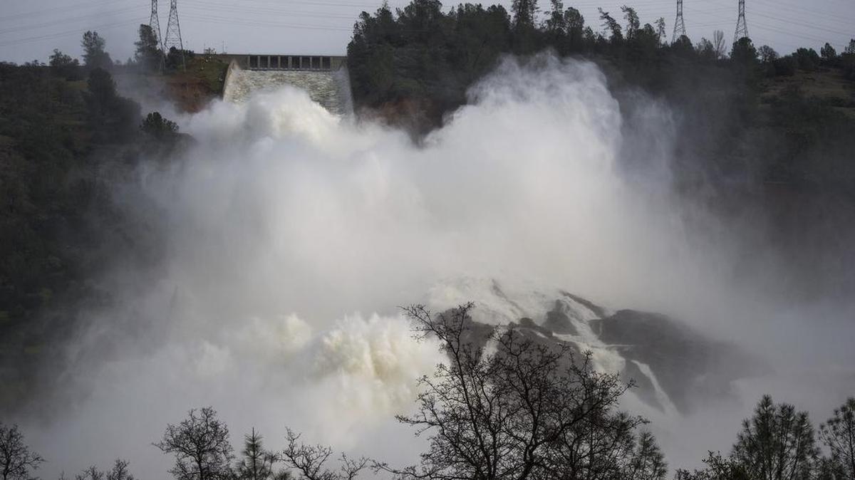 Water is released from the Oroville Dam on Monday, Feb. 13, at rates of up to 100,000 cubic feet per second, according to the Department of Water Resources.
