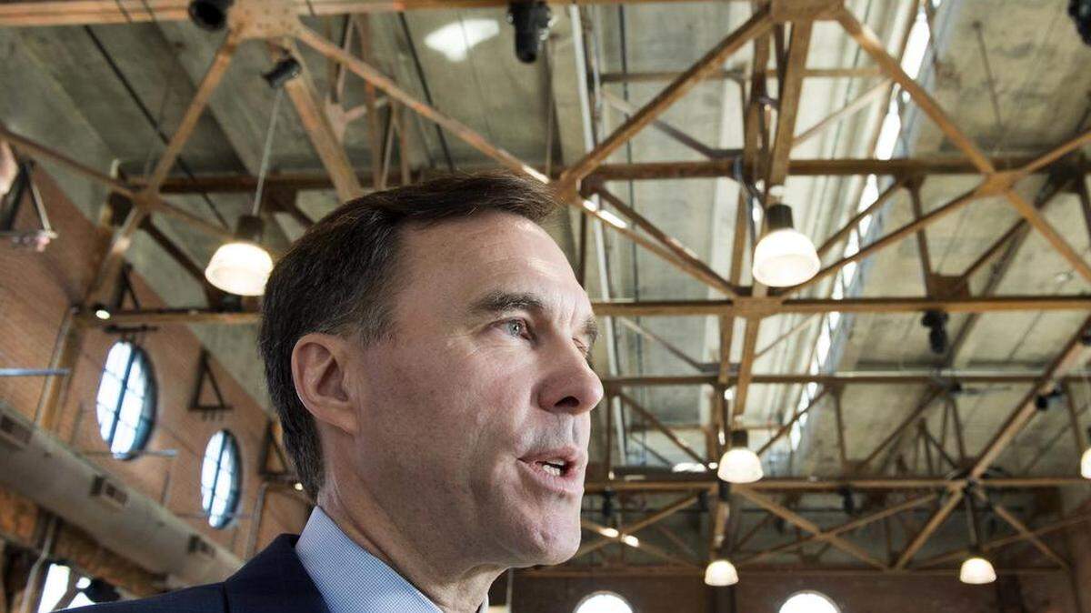 Canadian finance minister Bill Morneau, framed by structural steel, said Monday in Toronto that Canada should be exempted from steel tariffs President Donald Trump is weighing.