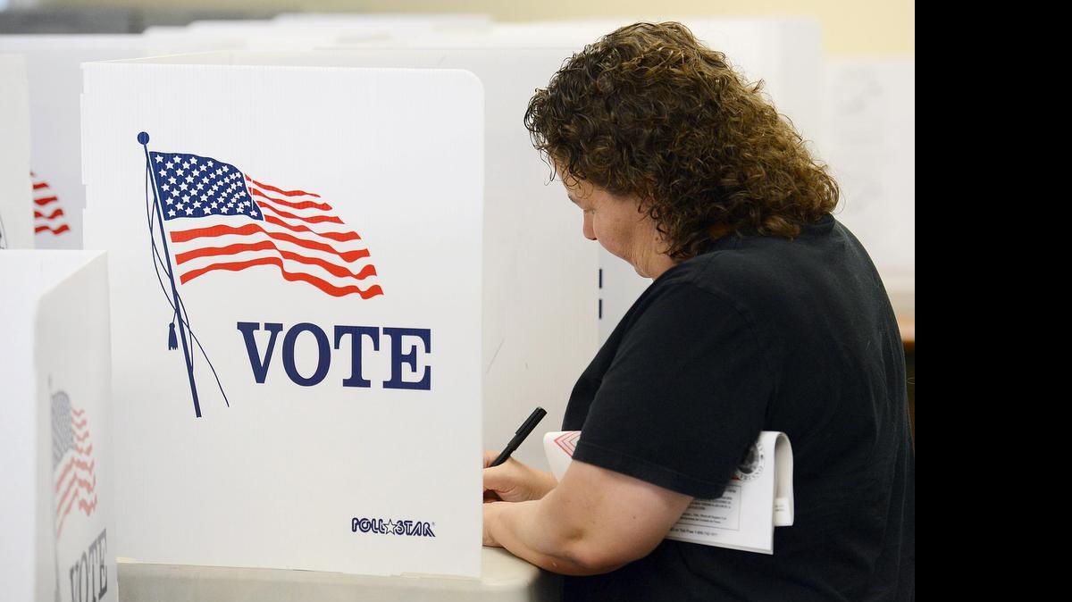
Wendy Nettles of Fresno votes at the Fresno County Clerk’s office in downtown Fresno on May 31, 2014. Statewide turnout in that primary election was a record low of 25%.
