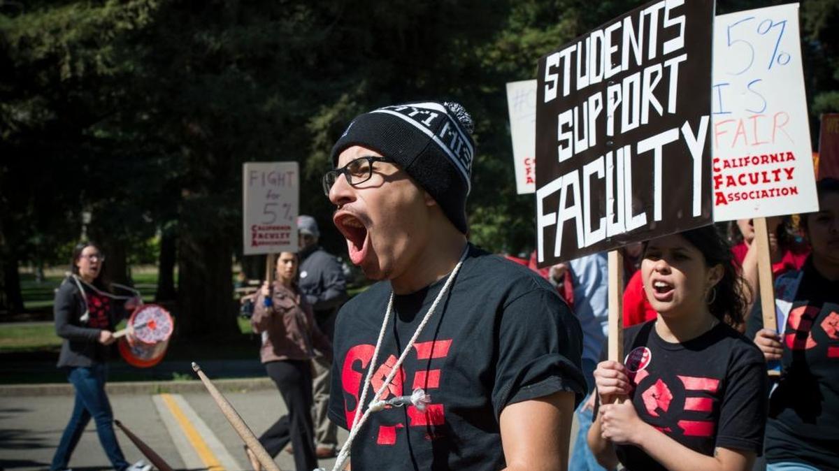 Marvin Morales marches at a rally last month at California State University, Sacramento, to demonstrate that students will stand with faculty if they are forced to strike. Two weeks after negotiating a 10.5 percent pay hike, the union that represents CSU faculty helped lead an effort to kill legislation that might have helped some students graduate within four years.