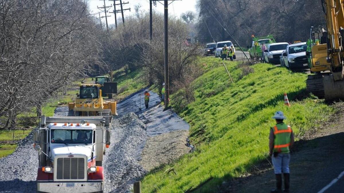 The California Department of Water Resources and MBK Engineers shore up a section of levee along the Sacramento River in the south Sutter County town of Verona, Calif., in 2017.