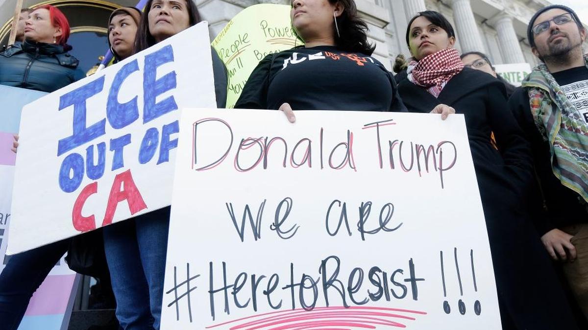 People who oppose President Donald Trump’s executive order on immigration rally outside City Hall in San Francisco on Jan. 25.
