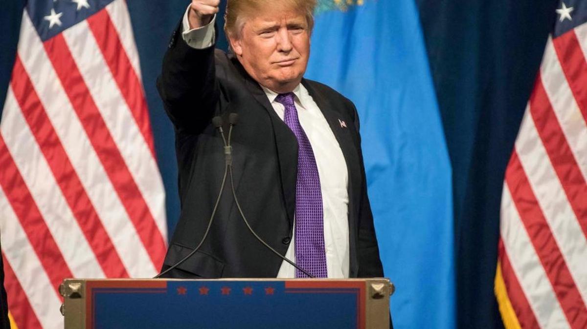 Donald Trump celebrates his victory in the Nevada caucuses – his third straight win –during a rally Tuesday night in Las Vegas.