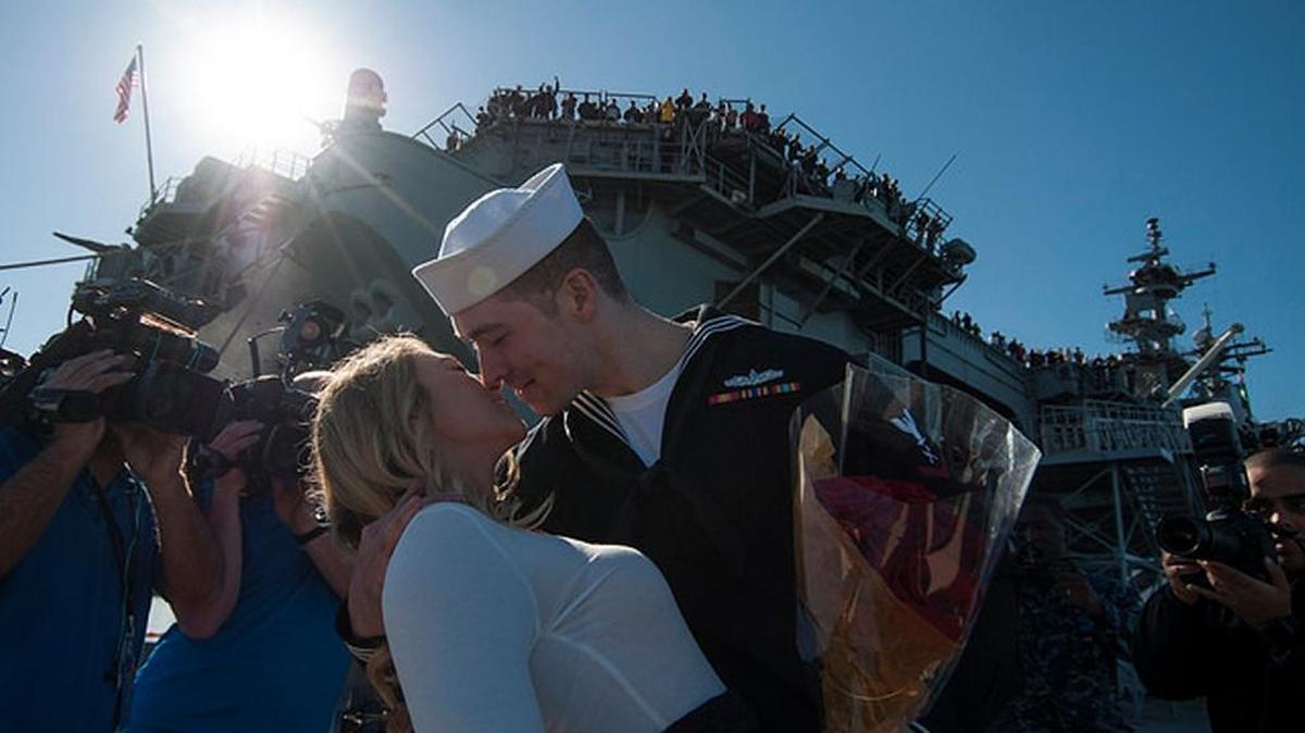It is a naval tradition to deliver a first kiss when a ship returns from a deployment. Jeremy Masiello of Clovis got the honor recently as the Wasp-class amphibious assault ship USS Essex returned.